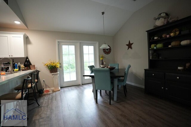 613 Macon St, Ludowici, GA 31316 - dining area with vaulted ceiling, dark wood finished floors, baseboards, and recessed lighting