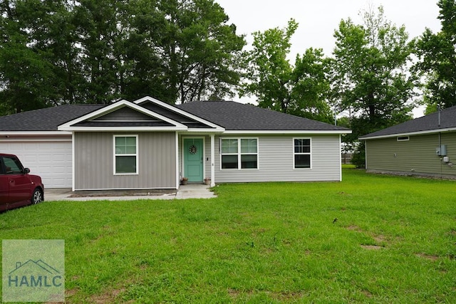 613 Macon St, Ludowici, GA 31316 - ranch-style home with a garage, a front yard, and roof with shingles