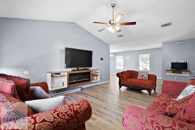 926 Poppleton Dr, Hinesville, GA 31313 - living room with wood finished floors, ceiling fan, vaulted ceiling, and baseboards
