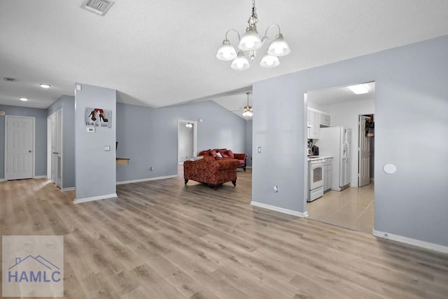 926 Poppleton Dr, Hinesville, GA 31313 - living room featuring baseboards, a ceiling fan, a chandelier, and light wood-type flooring