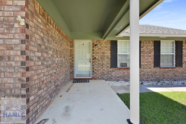 926 Poppleton Dr, Hinesville, GA 31313 - property entrance featuring brick siding and a shingled roof