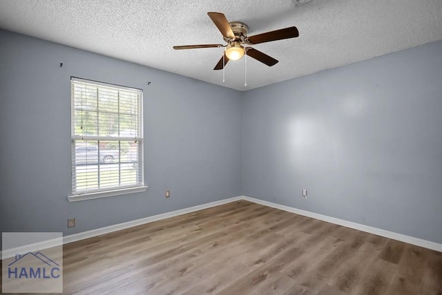 926 Poppleton Dr, Hinesville, GA 31313 - empty room featuring a textured ceiling, wood finished floors, a ceiling fan, and baseboards