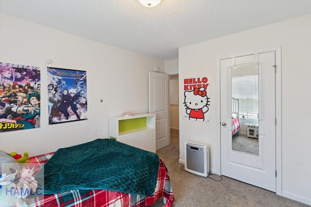 carpeted bedroom with a textured ceiling