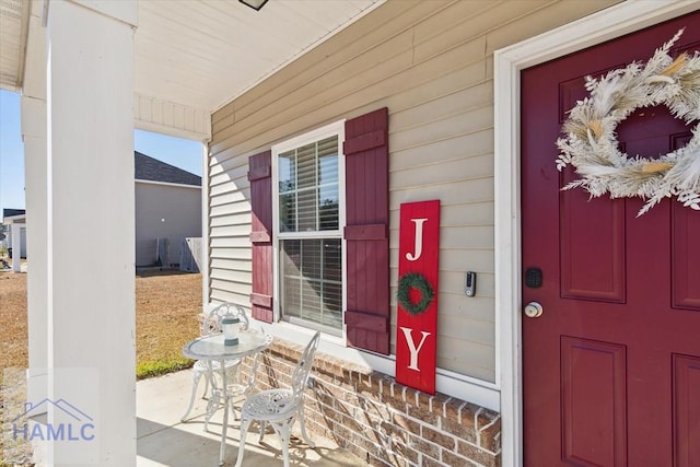 view of exterior entry featuring a porch