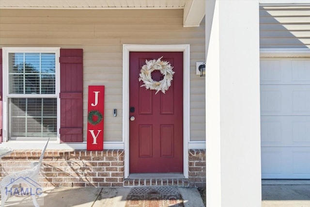 doorway to property featuring a garage