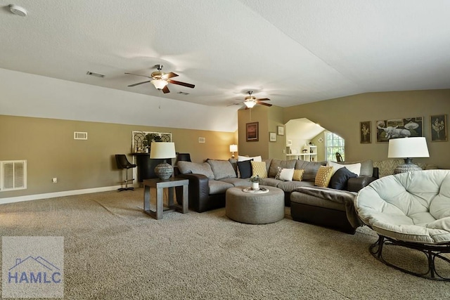 1653 Hawthorne Rd, Townsend, GA 31331 - living room with vaulted ceiling, a ceiling fan, carpet floors, baseboards, and arched walkways