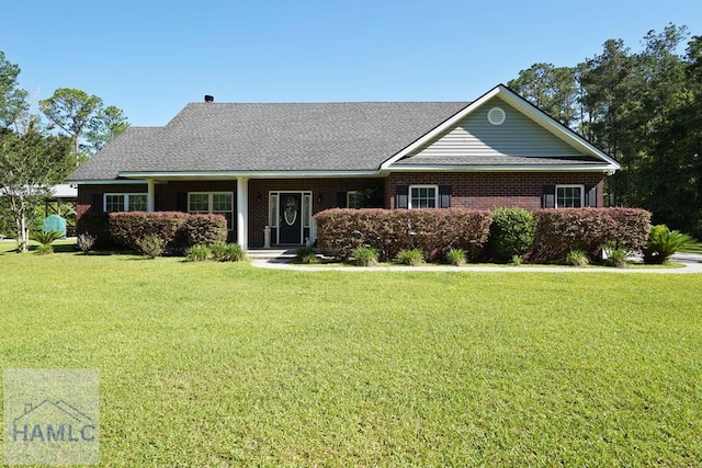 1653 Hawthorne Rd, Townsend, GA 31331 - view of front of home featuring a front yard and brick siding