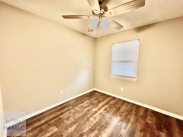 empty room featuring wood-type flooring and ceiling fan