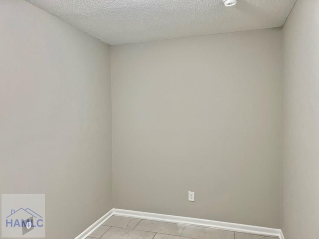 spare room featuring a textured ceiling