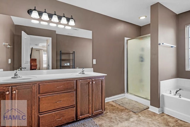 bathroom featuring tile patterned floors, vanity, and independent shower and bath