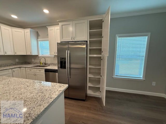 34 Pear St, Ludowici, GA 31316 - kitchen with stainless steel appliances, ornamental molding, white cabinetry, dark wood-type flooring, and recessed lighting