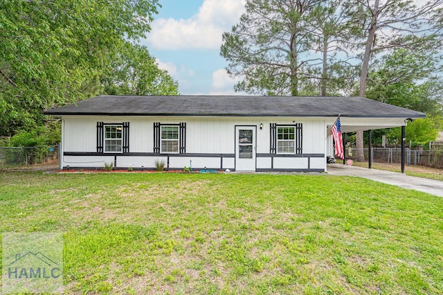 ranch-style home with driveway and a carport