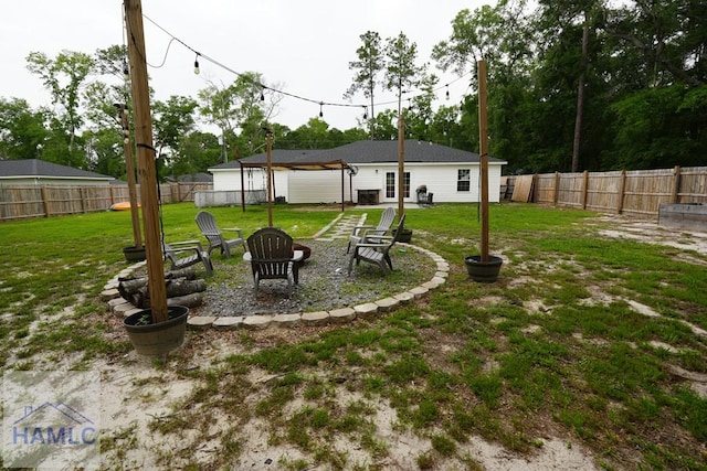 21 Oak Ridge Cemetery Rd SW, Ludowici, GA 31316 - view of yard featuring an outdoor fire pit