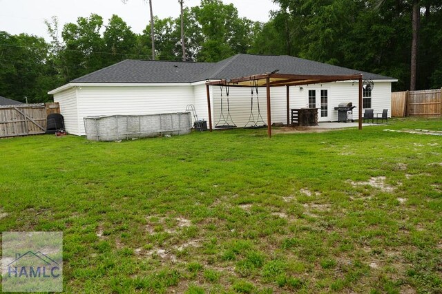 21 Oak Ridge Cemetery Rd SW, Ludowici, GA 31316 - rear view of property with a patio