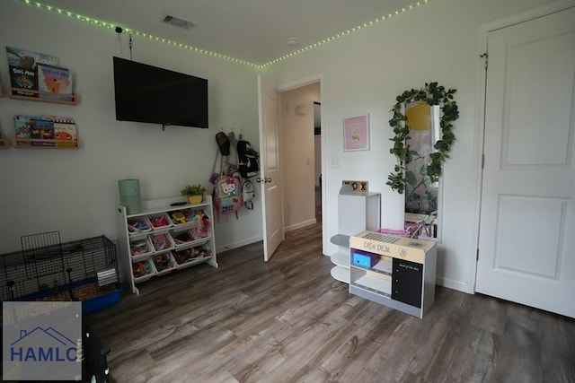 21 Oak Ridge Cemetery Rd SW, Ludowici, GA 31316 - recreation room with wood finished floors and baseboards
