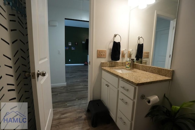 21 Oak Ridge Cemetery Rd SW, Ludowici, GA 31316 - bathroom with wood finished floors, vanity, and baseboards