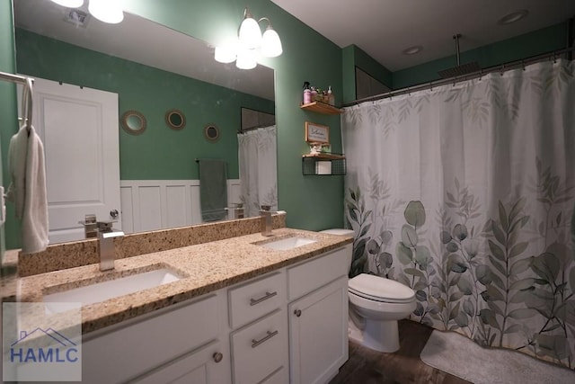 21 Oak Ridge Cemetery Rd SW, Ludowici, GA 31316 - full bathroom featuring toilet, wood finished floors, double vanity, and curtained shower