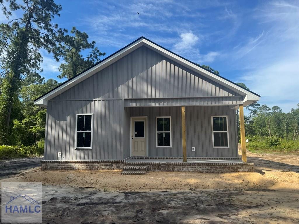 158N Deborah Cir, Jesup, GA 31546 - view of front of home featuring a porch and board and batten siding