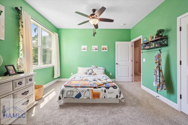 bedroom with carpet flooring, ceiling fan, and baseboards
