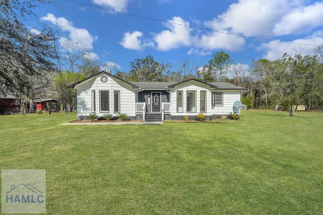 back of house featuring a yard