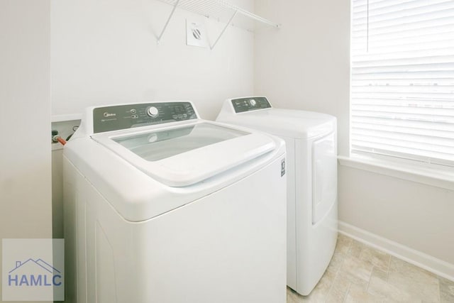 laundry room featuring washing machine and clothes dryer