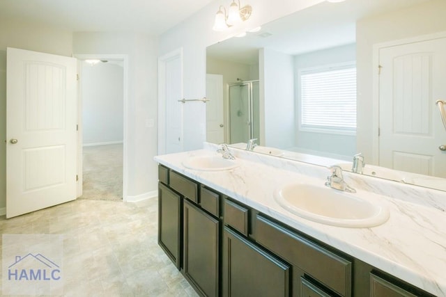 bathroom with a chandelier, vanity, and an enclosed shower