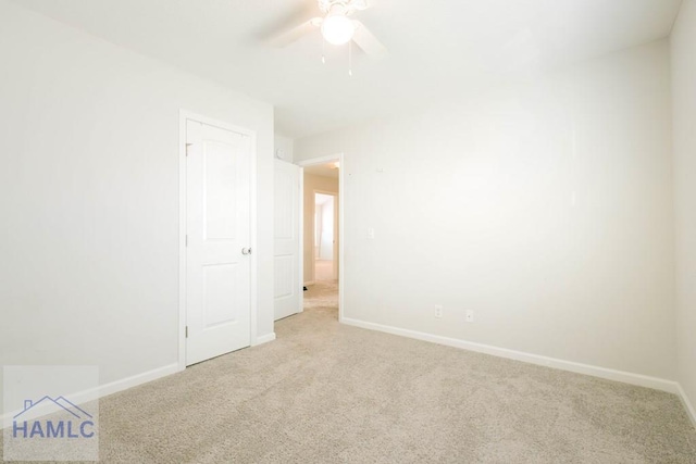 carpeted empty room with ceiling fan