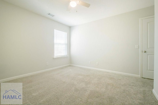 unfurnished room with ceiling fan and carpet