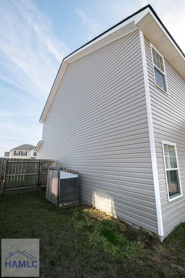 view of side of home featuring a lawn