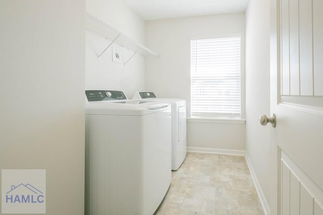 clothes washing area featuring washer and dryer