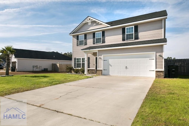 view of front facade featuring a garage and a front yard