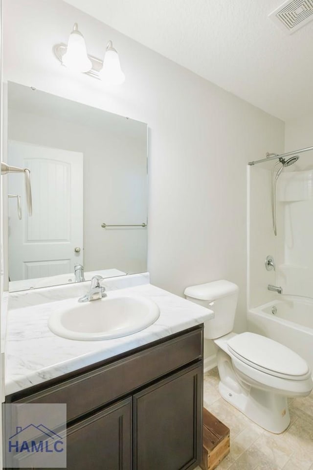 full bathroom featuring tile patterned flooring, vanity,  shower combination, and toilet