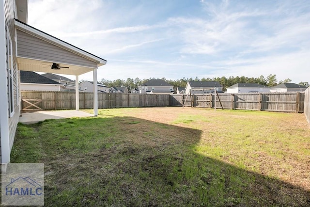 view of yard with ceiling fan