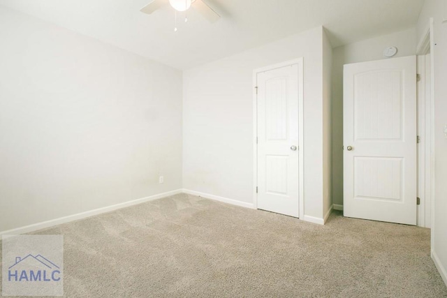 unfurnished bedroom with light carpet and ceiling fan