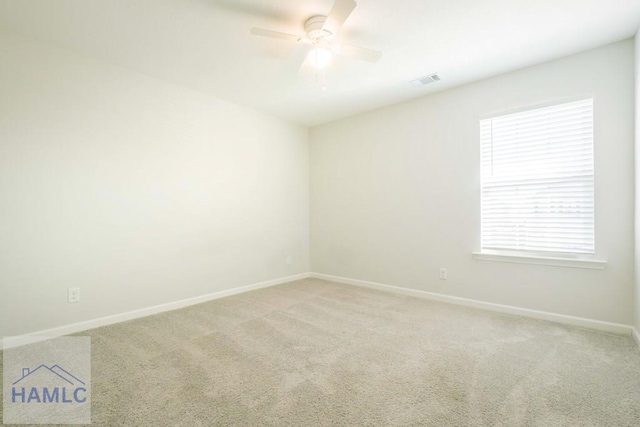 carpeted empty room with ceiling fan