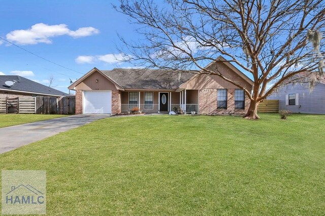 single story home with a garage and a front lawn