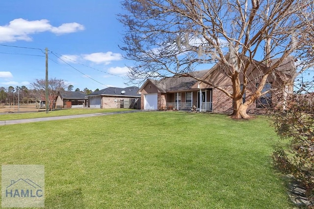 ranch-style house featuring a garage and a front yard