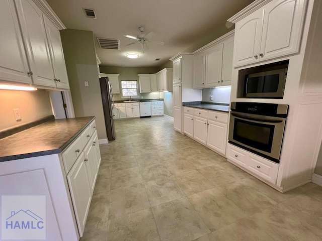 kitchen featuring white cabinets, ceiling fan, sink, and appliances with stainless steel finishes