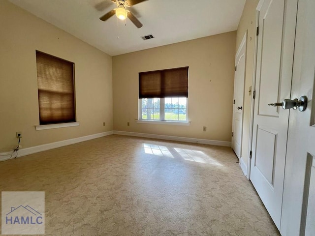 carpeted empty room featuring ceiling fan