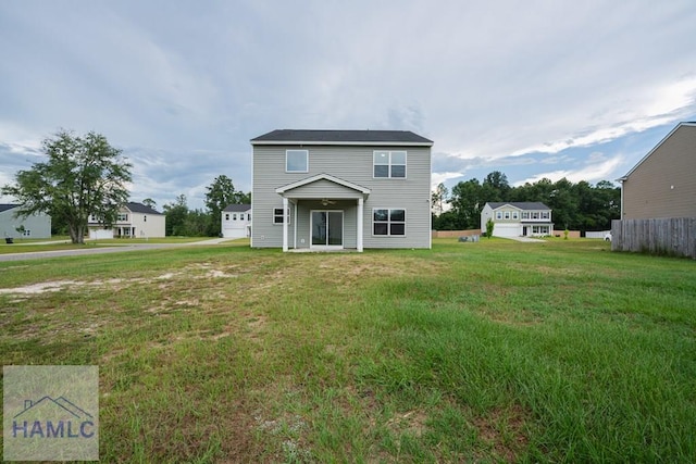 55 Enclave Way NE, Ludowici, GA 31316 - rear view of house featuring a yard