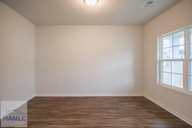 55 Enclave Way NE, Ludowici, GA 31316 - spare room with dark wood finished floors and baseboards