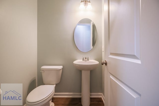 55 Enclave Way NE, Ludowici, GA 31316 - bathroom with toilet and wood finished floors