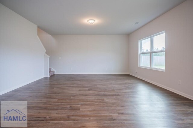 55 Enclave Way NE, Ludowici, GA 31316 - empty room featuring wood finished floors and stairway