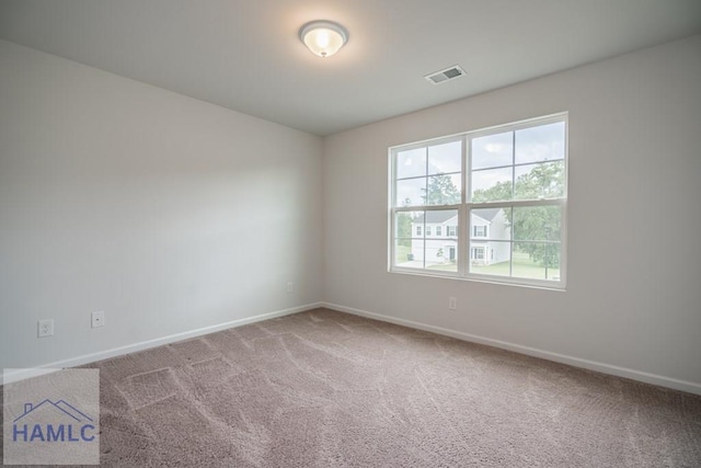 55 Enclave Way NE, Ludowici, GA 31316 - carpeted empty room with healthy amount of natural light