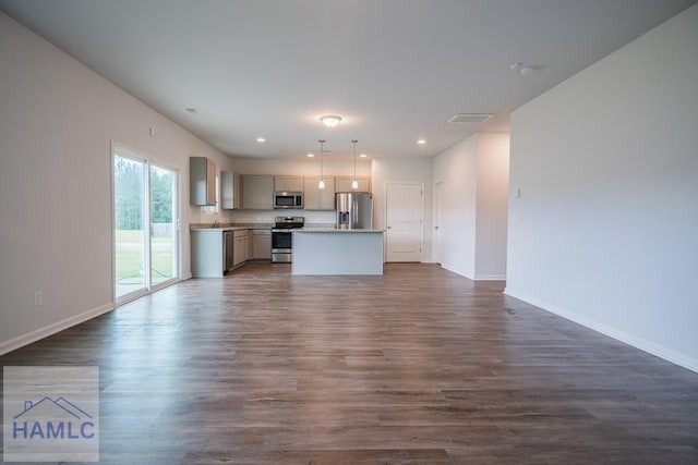 55 Enclave Way NE, Ludowici, GA 31316 - unfurnished living room with dark wood-style floors and recessed lighting