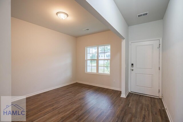 55 Enclave Way NE, Ludowici, GA 31316 - foyer featuring dark wood finished floors and baseboards