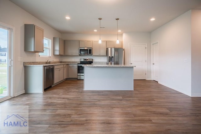 55 Enclave Way NE, Ludowici, GA 31316 - kitchen featuring appliances with stainless steel finishes, gray cabinetry, a center island, recessed lighting, and dark wood-style floors