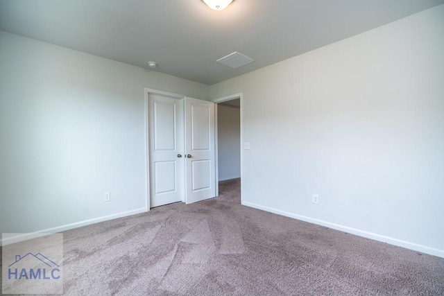 55 Enclave Way NE, Ludowici, GA 31316 - unfurnished bedroom featuring carpet floors and baseboards