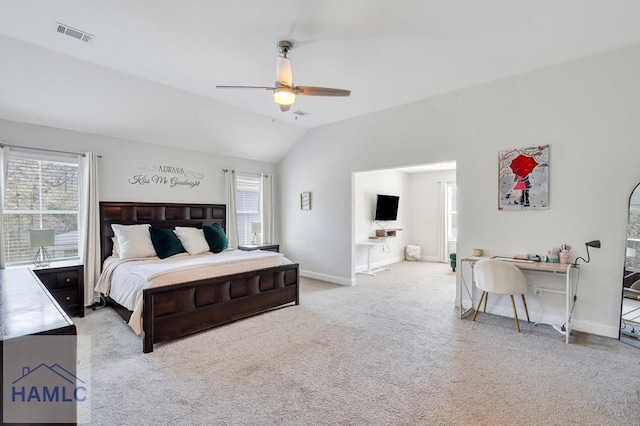 bedroom featuring visible vents, lofted ceiling, multiple windows, and carpet