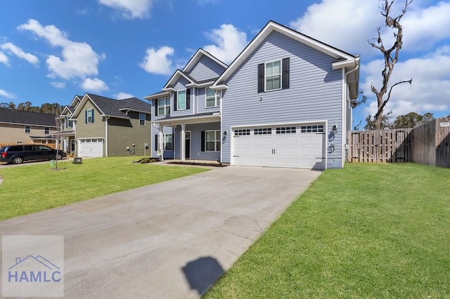 view of front of home with a garage, concrete driveway, a front yard, and fence